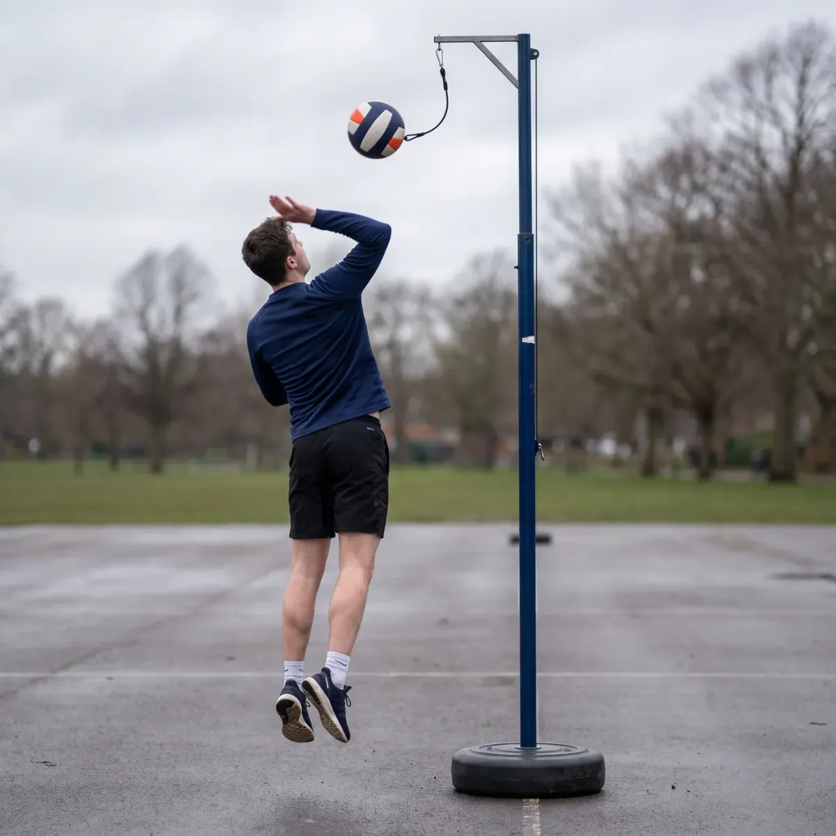 Hitting practice with the tether on an outdoor court